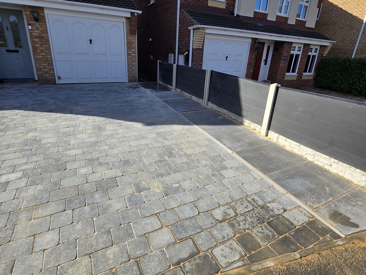 Finished block paved driveway with a porcelain side path in Castleford