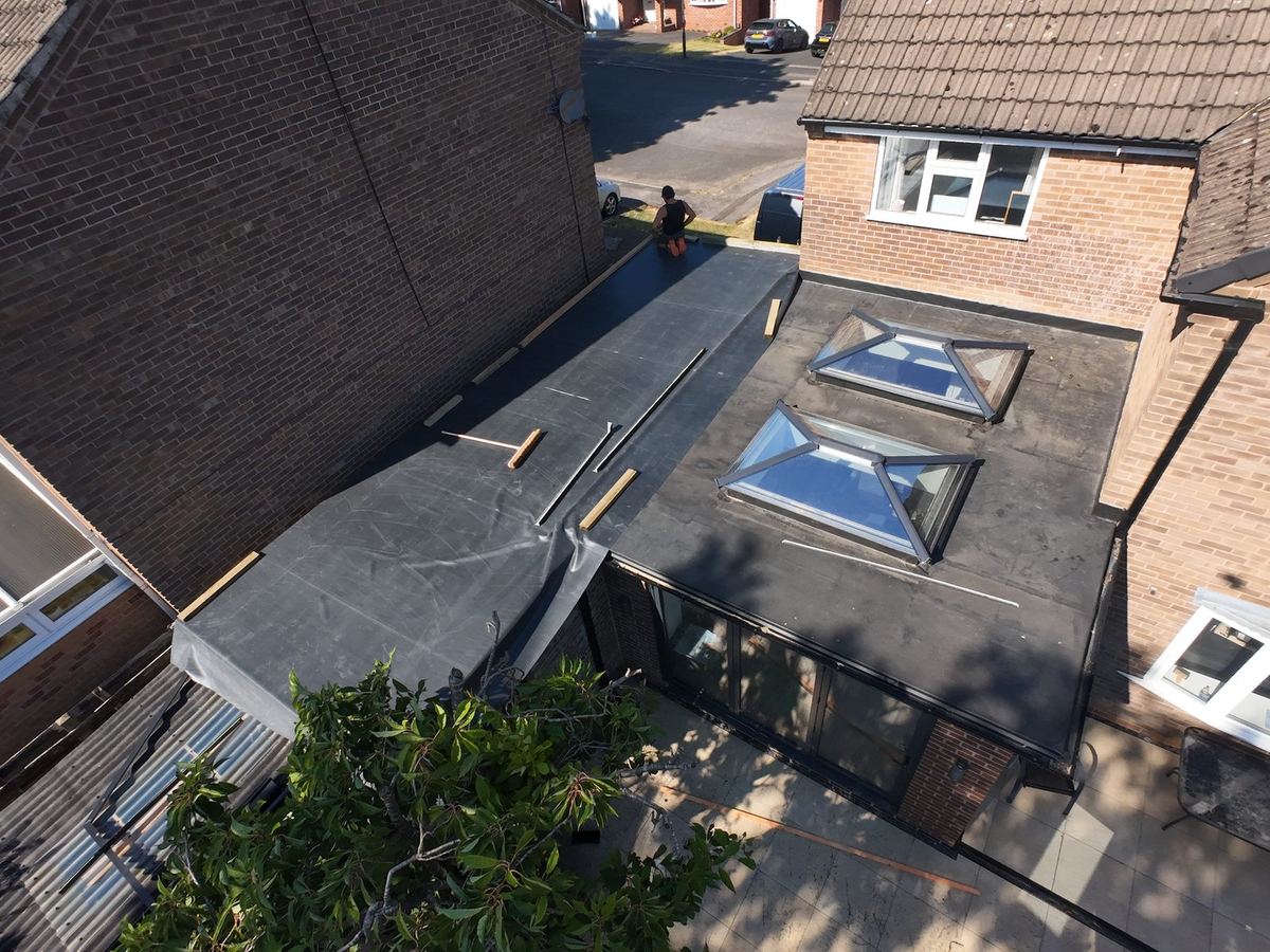 Drone view of a new rubber (EPDM) flat roof with two roof lanterns in Ripley